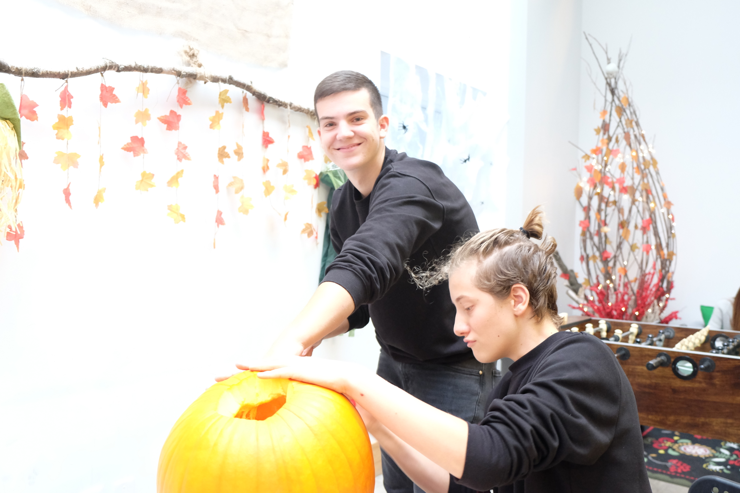 Keystone students carving pumpkin