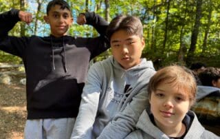 sep2026-camp-17 Three students posing together outdoors