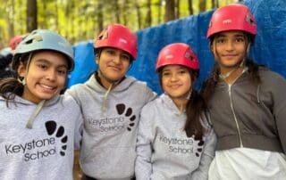 sep2026-camp-19 Four students in climbing helmets