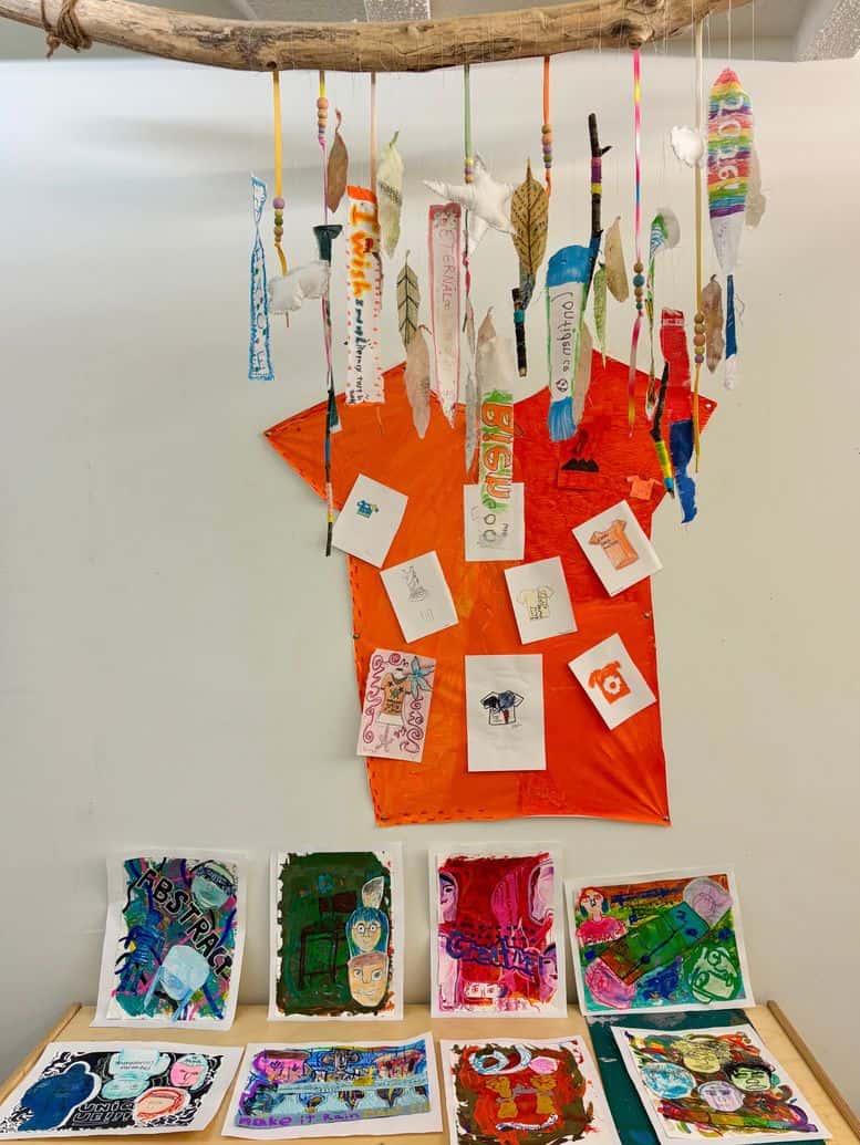 sep2026-orange-shirt-2 Paper orange shirts made by students hanging on a wall