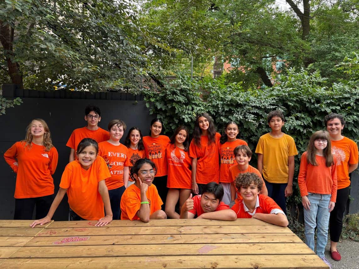 sep2026-orange-shirt-3 A group of students wearing orange shirts outdoors for Orange Shirt Day
